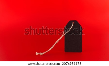 Black Friday Sale tag on red background in a panoramic format to use as header or web banner with copy space for text. Black Friday sale, shopping concept