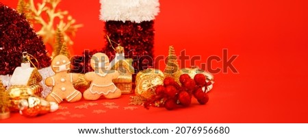 Happy New Year's 2022, Christmas set of gingerbread man and woman in face mask and red gold decorations on classic traditional red background, seasonal pandemic winter holiday banner, stay home