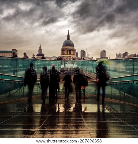 St Paul's Cathedral in the rain, as seen from the south bank of the Thames, looking across the Millennium Bridge.