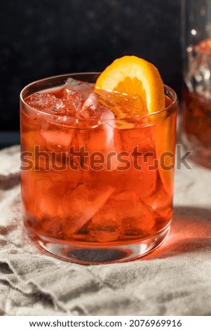 Cold Refreshing Rum Right Hand Negroni Cocktail with an Orange Garnish