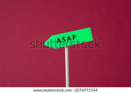 ASAP - As Soon As Possible acronym written in arrow sign on red background.
