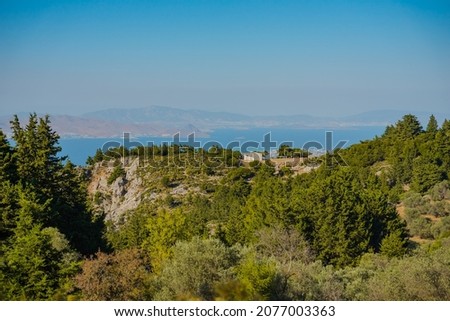 Kos island Greece,beautiful mountain covered by green forest and the  blue sea  in the distance.