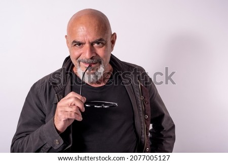 White background portrait of 60 years old mature man