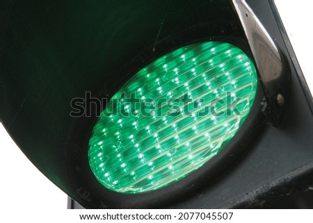 A bright green traffic light
