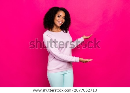 Photo of cool millennial brunette lady point empty space wear pink sweater isolated on magenta color background