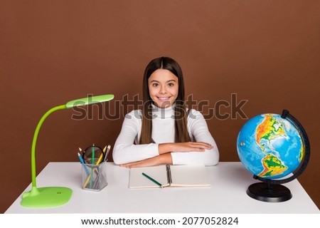 Photo of youth cheerful lady pupil sit table listen teacher smart isolated over brown color background