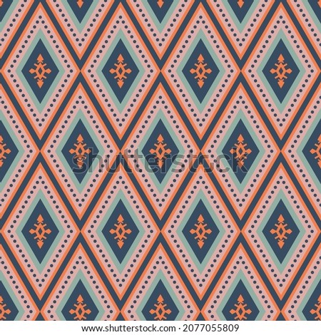 Colorful boho southwest seamless vector pattern. Navy blue, orange, pink and green bohemian style geometric diamond design. Decorative print with western shapes. Repeat background surface texture.