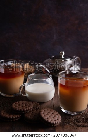 Tea with milk sugar and cookies