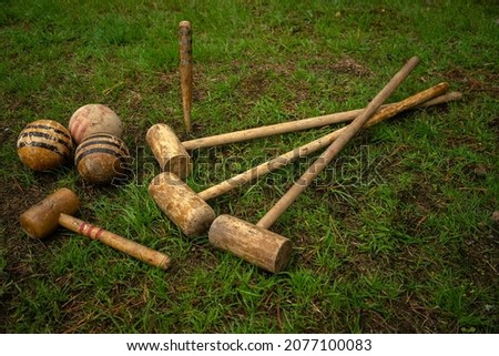 Vintage croquet set. Wooden clubs with croquet balls. An old-fashioned outdoor game. Royalty-Free Stock Photo #2077100083