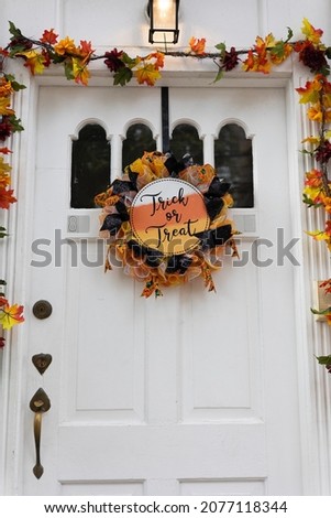 Trick or treat sign on the door of the house