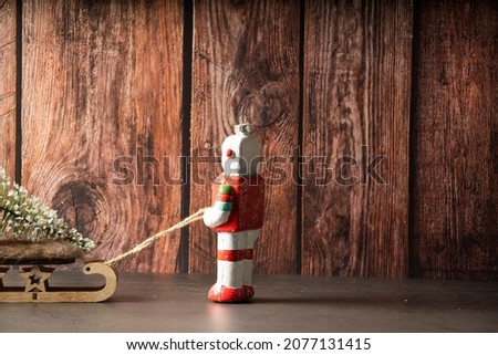 Christmas robot pulling a sled from behind