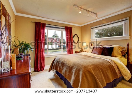 Bedroom interior in soft brown tone with red curtains