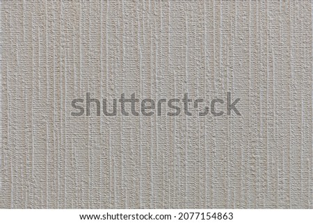 Texture of wallpaper or linen. Close-up vertical volumetric stripes. Fabric made of eco materials.