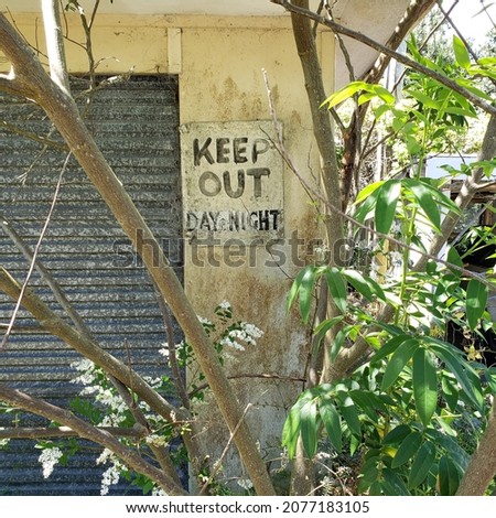 Keep Out sign on a garage wall in Auckland, New Zealand