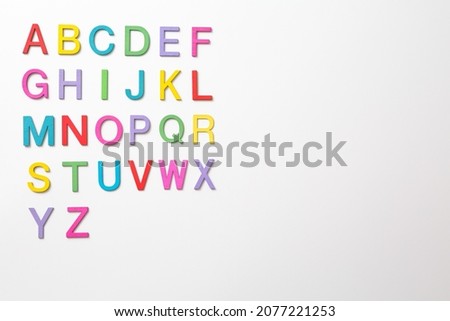 Colorful wooden english letters A-Z on white background and copy space for educational and graphic concept