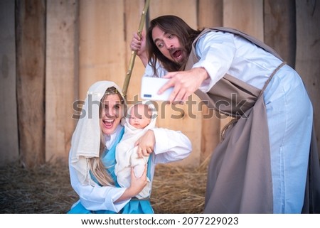 Biblical characters taking selfie while laughing and joking. Nativity scene