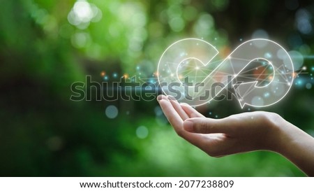 hand hold the circular economy icon. The concept of eternity, endless and unlimited, circular economy for future growth of business and environment sustainable  Royalty-Free Stock Photo #2077238809