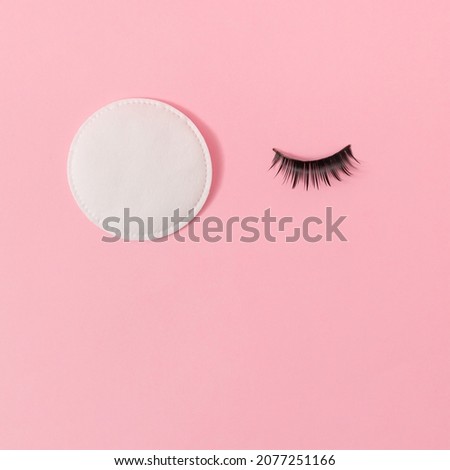 Eyelash and makeup remover wipe on pastel pink background. Minimal skincare cosmetic concept. Beauty flat lay composition. Royalty-Free Stock Photo #2077251166
