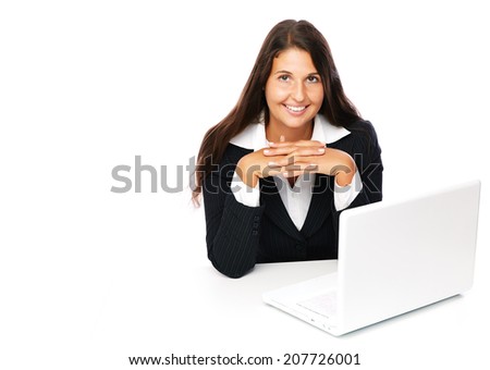 Business woman sitting at table with her laptop and smiling  looking at camera. Isolated on a white background. 