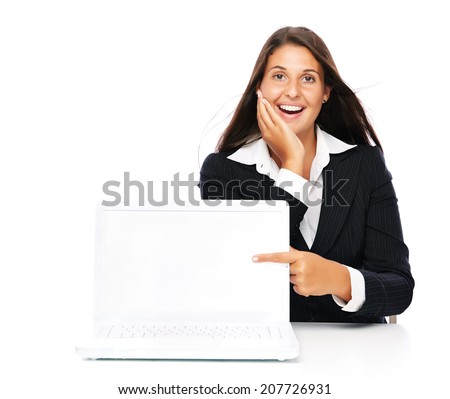 Business woman excited pointing at empty white laptop.   Isolated on a white background.