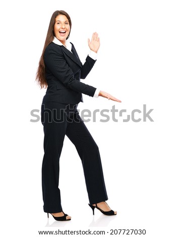Business woman in suit is happy and showing with her hands.   Isolated on a white background.