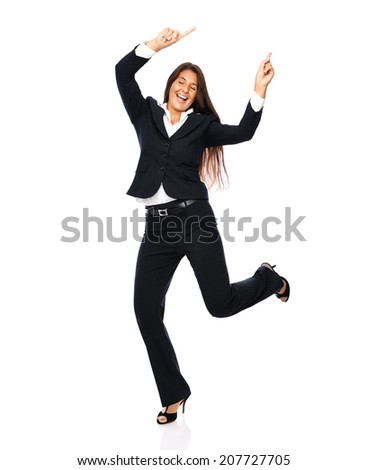 Business woman in a black suit dancing is happy cheerful.    Isolated on a white background.