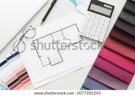House plan, color palettes and fabric samples on light background