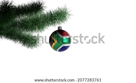 New Year's ball with the flag of South Africa on a Christmas tree branch isolated on white background. Christmas and New Year concept.