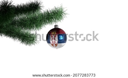 New Year's ball with the flag of Serbia on a Christmas tree branch isolated on white background. Christmas and New Year concept.