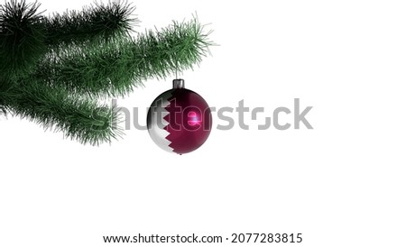 New Year's ball with the flag of Qatar on a Christmas tree branch isolated on white background. Christmas and New Year concept.