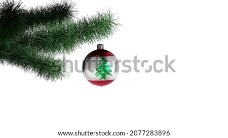 New Year's ball with the flag of Lebanon on a Christmas tree branch isolated on white background. Christmas and New Year concept.