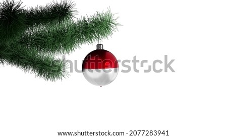 New Year's ball with the flag of Indonesia on a Christmas tree branch isolated on white background. Christmas and New Year concept.