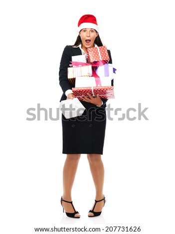 Business woman with santa claus hat is holding parcels and has christmas stress.   Isolated on a white background.