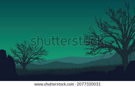 A beautiful view of the mountains from the countryside at night with beautiful dry tree silhouettes. Vector illustration of a city