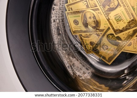Money in washing machine, closeup view. Money washing. Money laundering