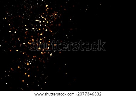Abstract black background with defocused sequins. Holiday concept.