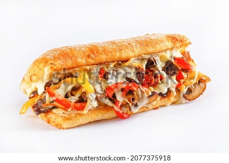 Philly cheese steak sandwich with roasted beef, pepper, caramelized onion, mushrooms and melted cheese on a white background Royalty-Free Stock Photo #2077375918