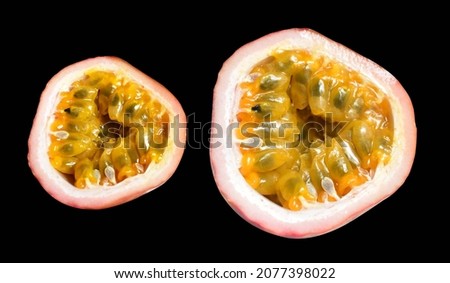 Fresh passion fruit slices, half, pieces isolated with clipping path in black background, no shadow, healthy fruit