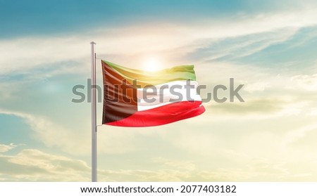 Kuwait national flag waving in beautiful sky. Royalty-Free Stock Photo #2077403182