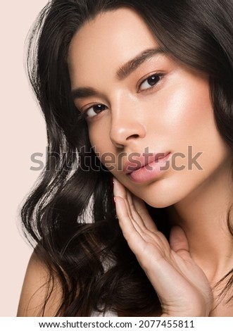 Asia beauty woman touching her face healthy skin close up model portrait. Color background. Pink