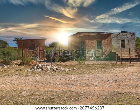African houses in a poor area, ghetto living Royalty-Free Stock Photo #2077456237