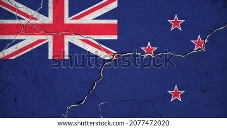 An image of the New Zealand flag on a wall with a crack. Background.