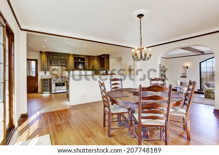 Bright dining room in luxury house. View of kitchen room