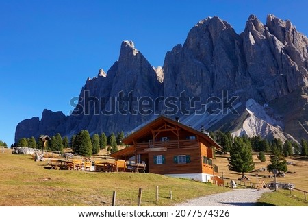  View of Geislergruppe or Gruppo delle Odle with chalet Dolomites, Italy , Europe                             Royalty-Free Stock Photo #2077574326