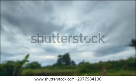 defocused abstract background of clouds and trees 