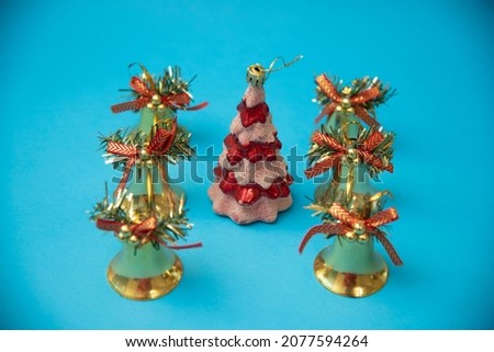 New Christmas concept. Lamps, Christmas tree and gifts on a blue background