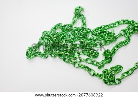 Green chain, jewelry. A chain is a sequential assembly of related parts, with an overall rope-like character as it is flexible and curved.