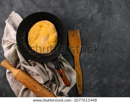 Homemade corn flatbread meal frying pan linen cloth. Handmade mexican tortilla for wrapping. Traditional latin cornmeal dough bread top view Authentic cuisine Taco Quesadilla cooking recipe ingredient