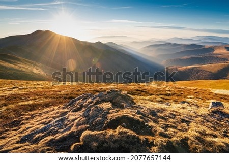 Wonderful sunset in the Carpathians. Mountain travel, freedom and active lifestyle concept. The beauty of the Carpathian Mountains. Bright photowall-paper. Royalty-Free Stock Photo #2077657144