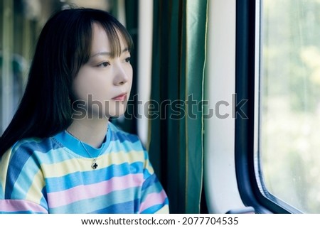 Asian women in the green train carriage